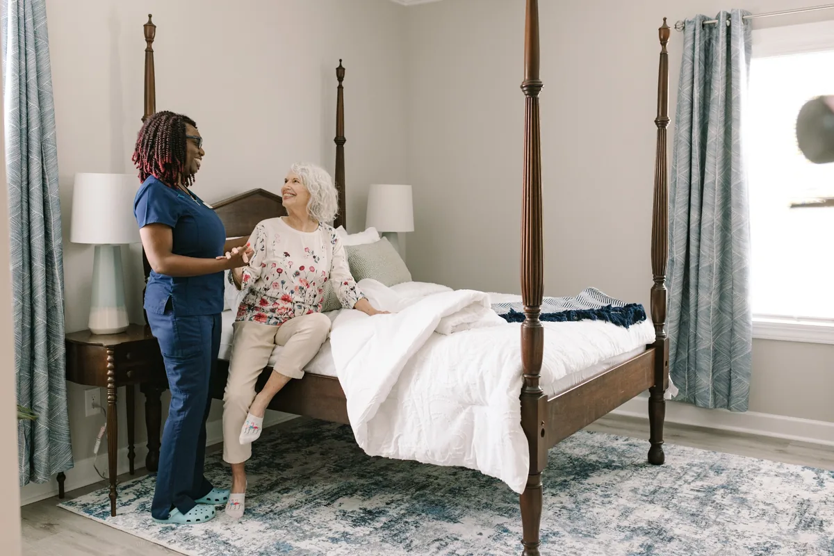 DayBreak caregiver helping an older adult with a familiar daily routine at home