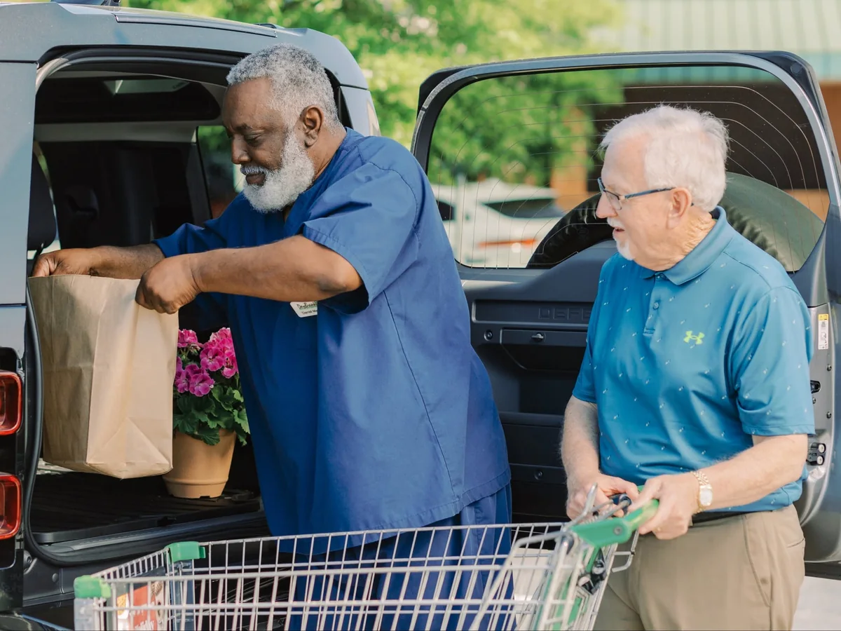 DayBreak caregiver helping an older adult with groceries and everyday errands