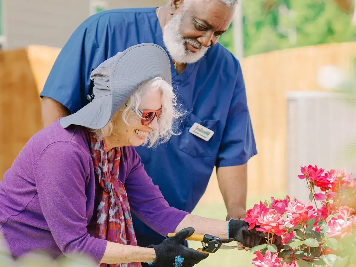 DayBreak caregiver helping an older adult client at home