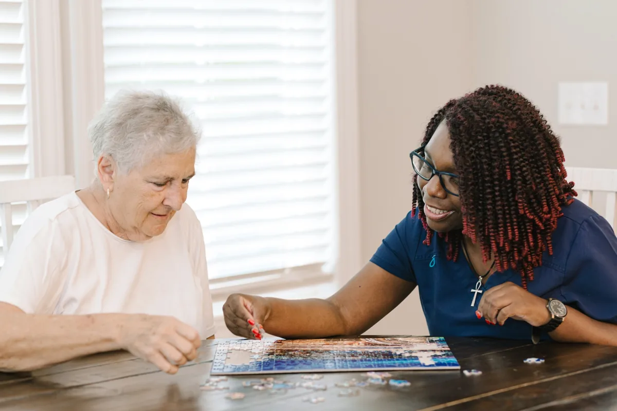 DayBreak caregiver spending one-on-one time with an older adult client